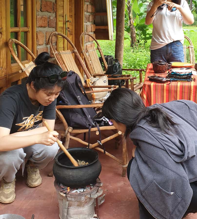 Arusha: Traditional Coffee Preparation(coffee tour) - Roasting beans in a clay pot over charcoal