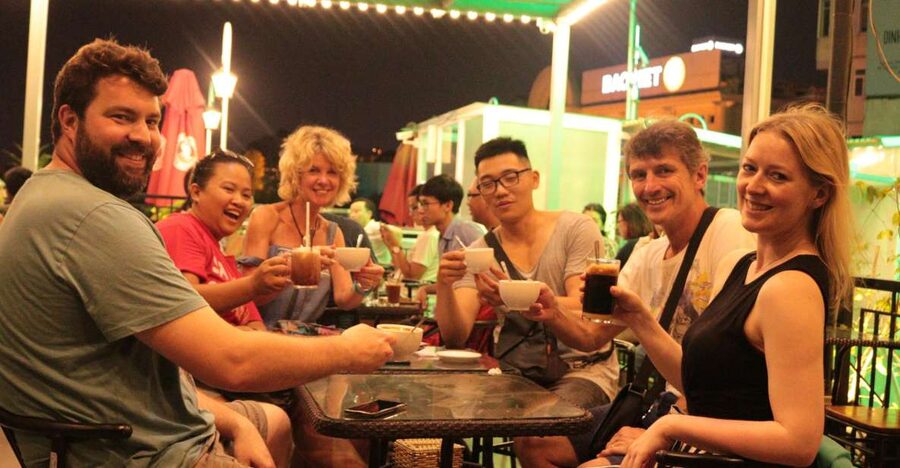 Discover Hanoi's Street Food by Night & Mini Class Coffee - Walking through the Old Quarter between meals