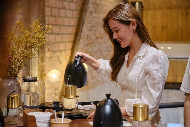Layered Vietnamese salt coffee in a glass on a workshop counter