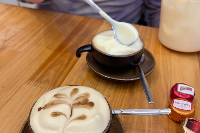 Hanoi Egg Coffee & Coconut Coffee Making Class with Free Banh Mi - The café setting and a possible location change