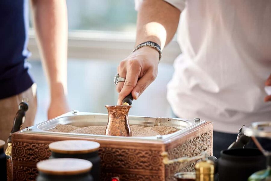 Istanbul: Turkish Coffee Making on Sand & Fortune Telling - Choosing beans and turning the hand mill